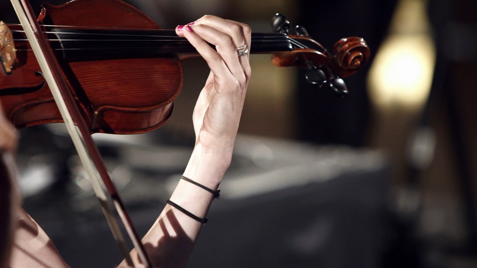 Violinist performing, close-up detail