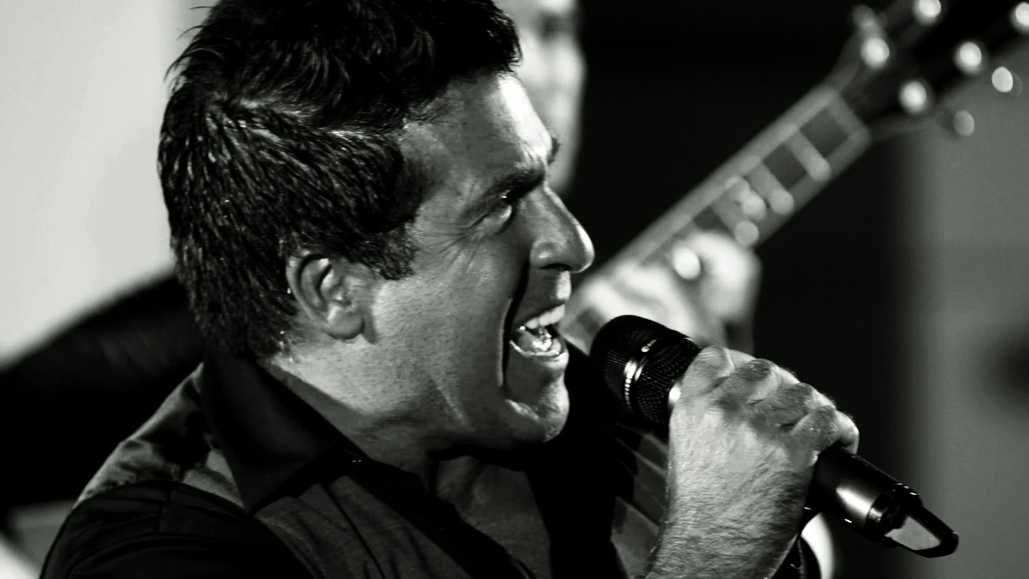 Steve DeLisi singing with intensity